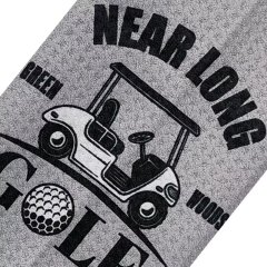 Custom logo golf towel with golf cart graphic on gray surface