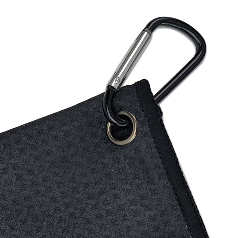 Golf towel with metal grommet and carabiner clip close-up