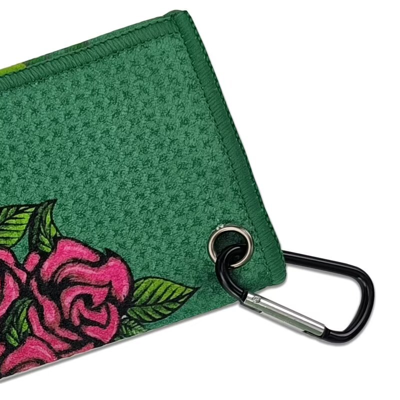 Golf towel with carabiner clip and reinforced metal gromme