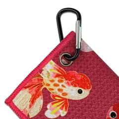 Golf towel with carabiner clip and reinforced metal grommet