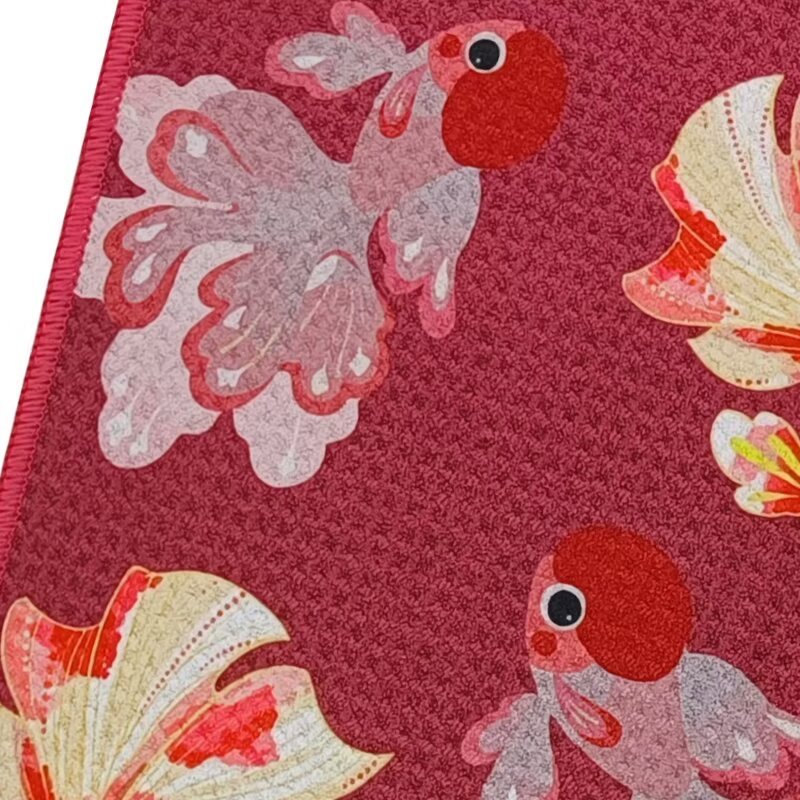 Custom printed golf towel with red goldfish pattern close-up