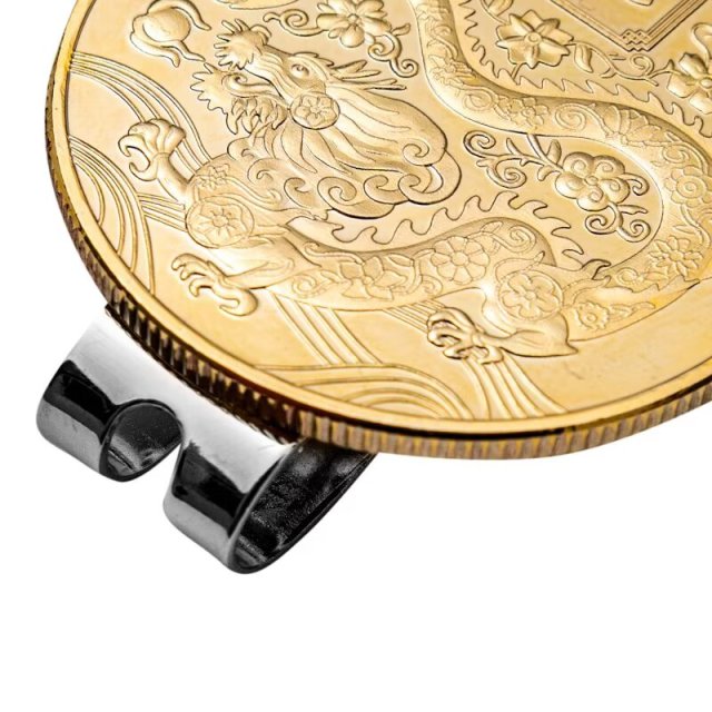 Gold tone metal golf ball marker coin with magnetic hat clip detail