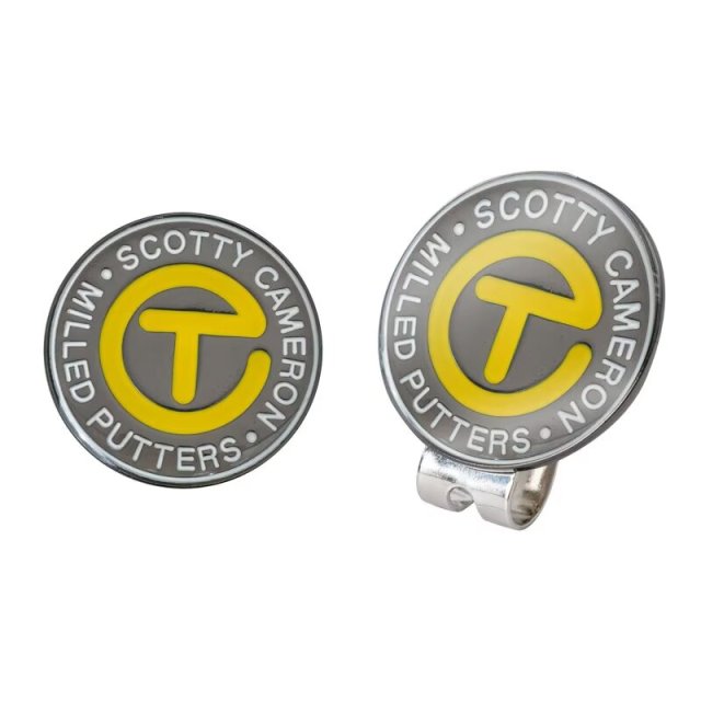 Branded golf ball marker with magnetic hat clip and custom yellow logo design