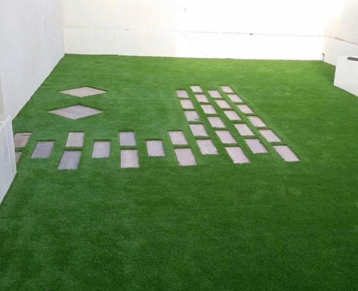 Low-profile decorative artificial grass carpet for urban balcony and terrace decor.