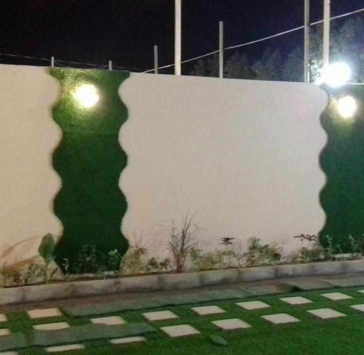Lush multi-tone leisure artificial grass installed in a modern residential garden.