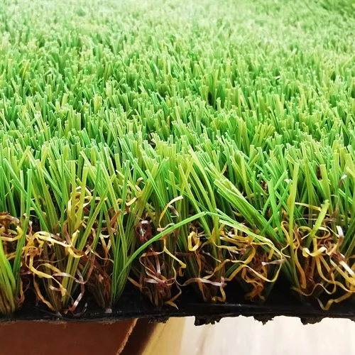 Close-up of realistic synthetic turf blades showing natural grass appearance and texture.