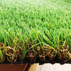 Close-up of realistic synthetic turf blades showing natural grass appearance and texture.