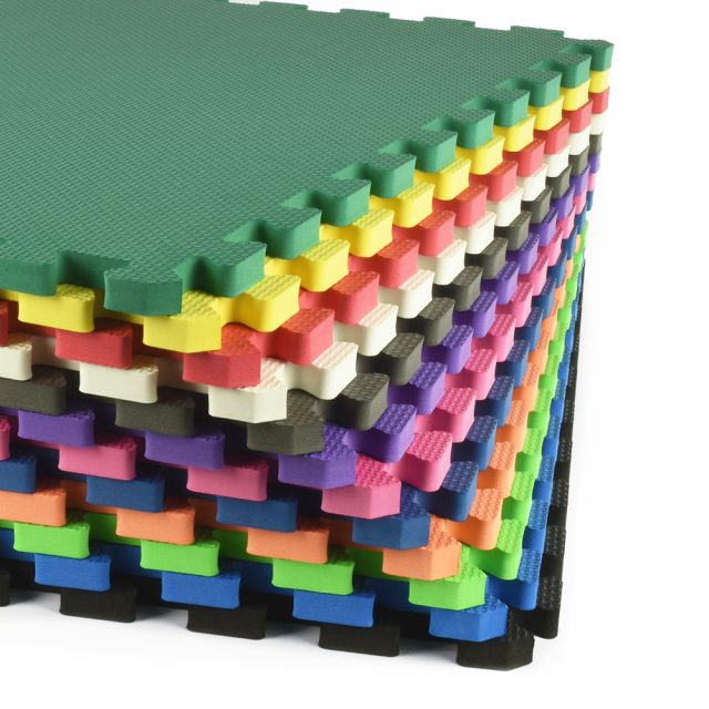 Premium 5/8 inch foam mats used as anti-fatigue flooring in a home woodworking shop.