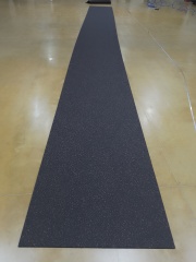 Durable EPDM rubber rolls installed in a high school weight room for sound ingestion.