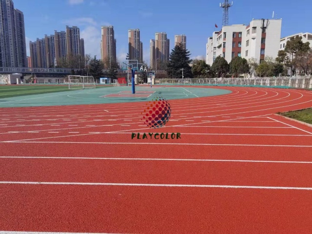 Professional stadium installation of an IAAF certified sandwich system athletic track.