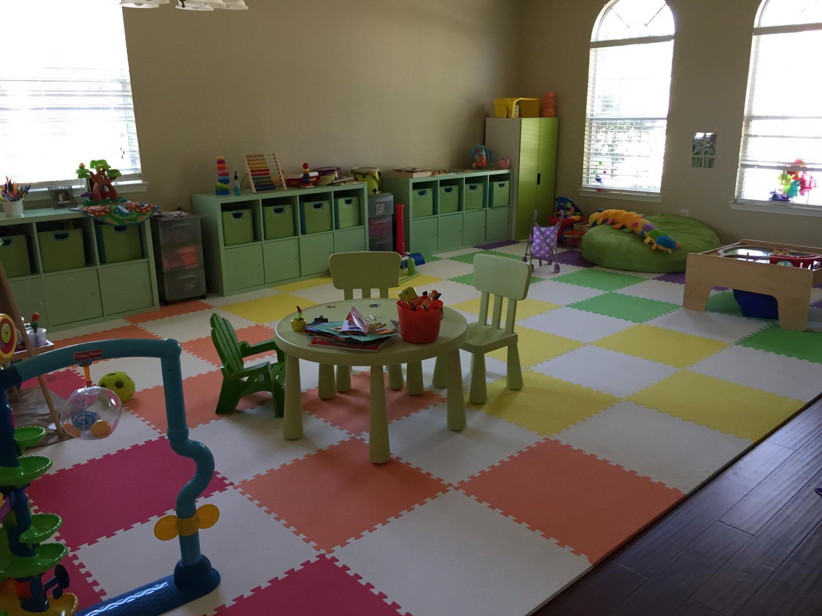 Creative checkerboard pattern in a kids' bedroom using multi-colored interlocking foam tiles.