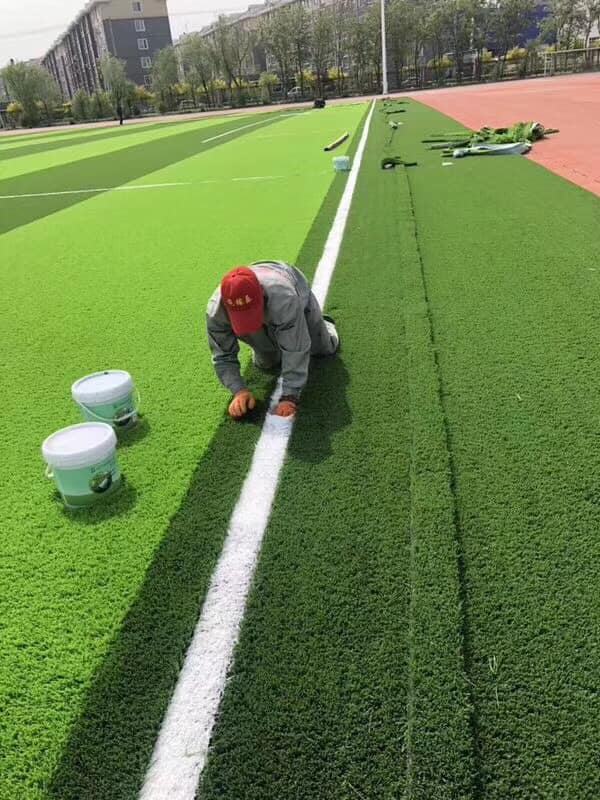 Soft and elastic synthetic turf ideal for school playgrounds and multi-sport play.