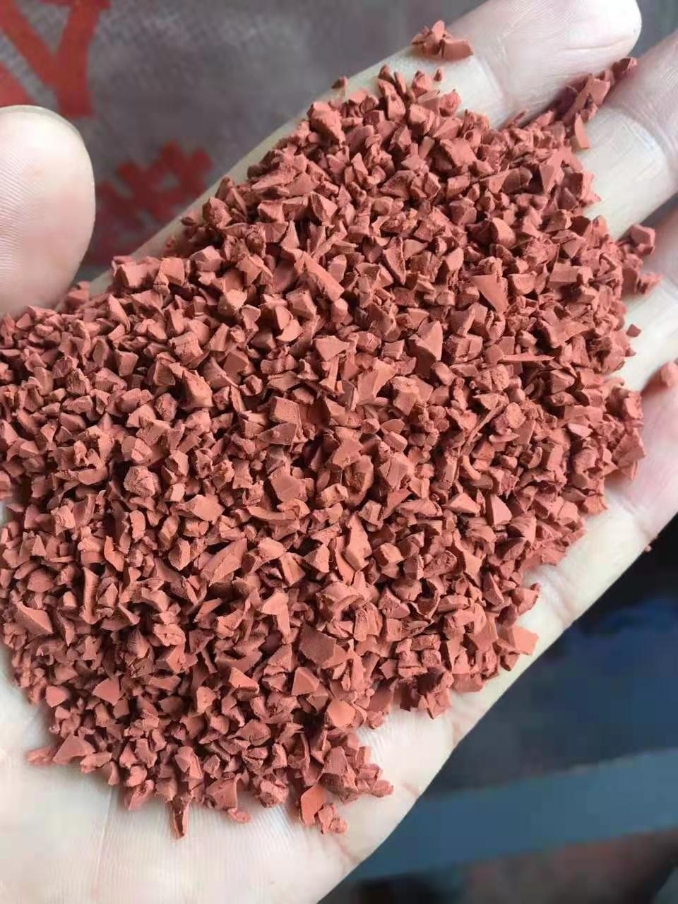 Self-draining outdoor rubber running track surface showing quick drainage capabilities.