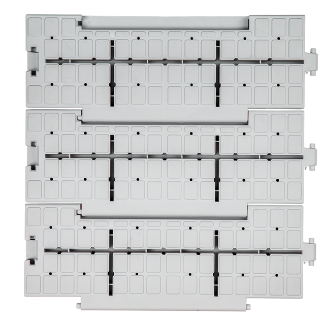 Close-up of the anti-slip surface and drainage holes of PP event tiles.