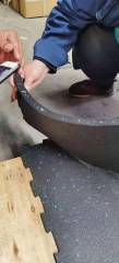 Easy DIY interlocking rubber tiles being assembled in a residential garage home gym.