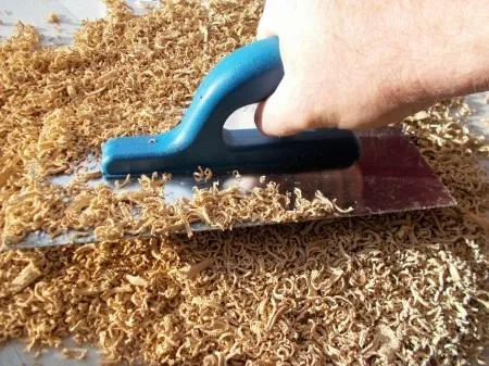 Close-up texture of 100% dyed-through EPDM rubber mulch showing permanent color stability.