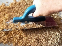 Close-up texture of 100% dyed-through EPDM rubber mulch showing permanent color stability.