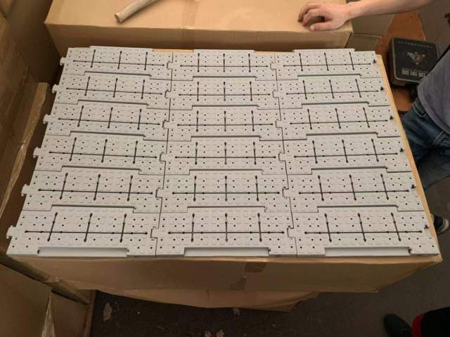 Event flooring tiles assembled in roll shape for easy paving and transport.