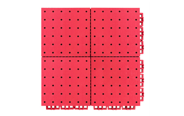 Close-up of the reinforced interlocking perimeter joint and small grid soft connection design on a 305×305mm thermoplastic rubber sports tile, showing the flexible joint geometry that accommodates thermal expansion and contraction in large outdoor sports surface installations.
