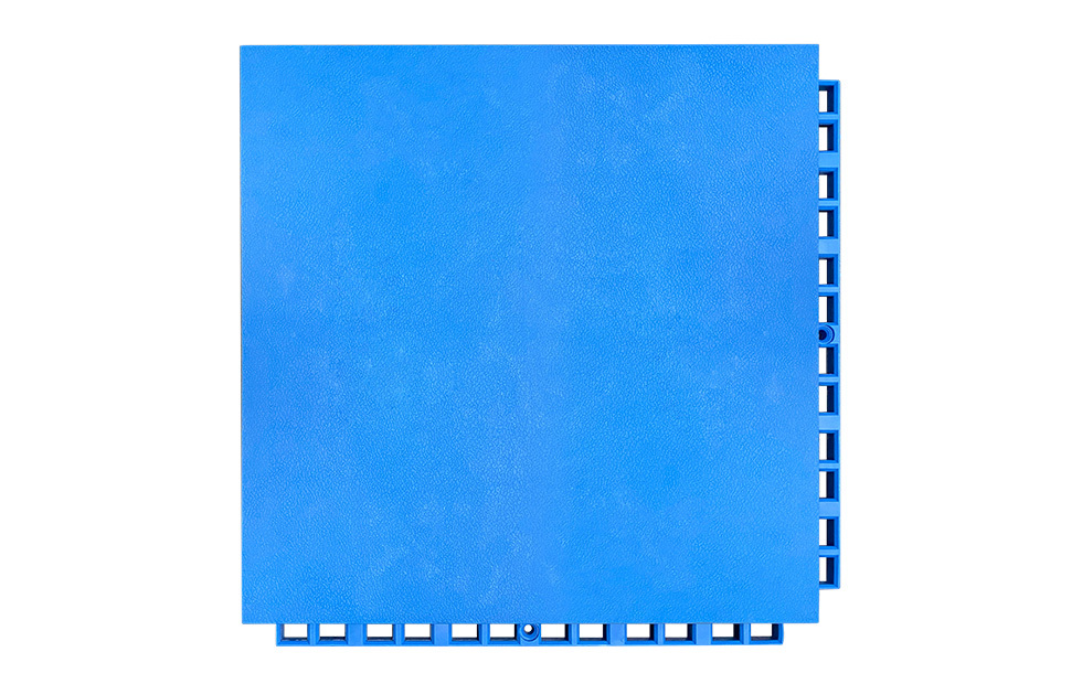 Top-down view of a 305×305×16mm thermoplastic rubber indoor court sports flooring tile showing the solid hexagonal surface pattern and anti-slip texture surface, designed for grip under the dynamic foot loads of basketball, volleyball, futsal, and bowling court applications.