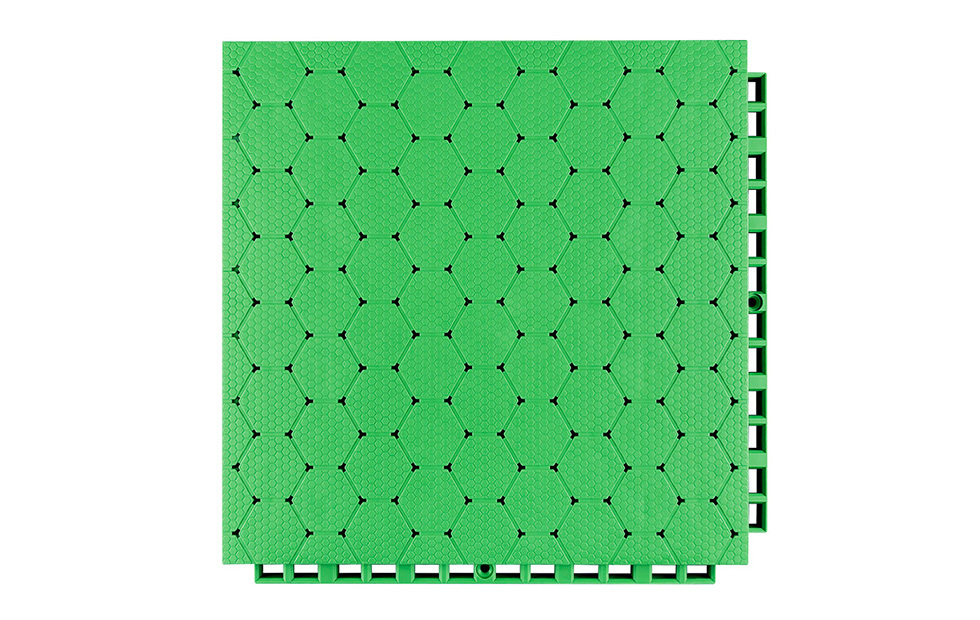 Top-down view of a 305×305×16mm thermoplastic rubber sports flooring tile showing the thickened hexagonal surface texture, designed for anti-slip grip on outdoor school sports courts and municipal fitness project surfaces under wet and dry conditions.