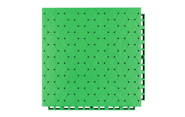 Top-down view of a 305×305×16mm thermoplastic rubber sports flooring tile showing the thickened hexagonal surface texture, designed for anti-slip grip on outdoor school sports courts and municipal fitness project surfaces under wet and dry conditions.
