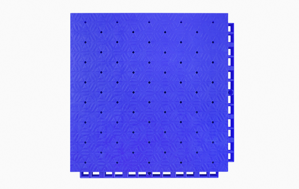 Top-down view of a 305×305×21mm thermoplastic rubber sports flooring tile showing the thickened hexagonal dark pattern surface texture and the large flat soft material surface layer, designed for anti-slip performance and fall protection in professional school and college sports venues.