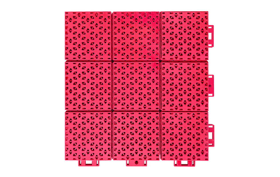Profile and cross-section view of a 305×305×16mm PP interlocking playground tile showing the thickened and reinforced upper and lower hexagonal layers of the double-layer hexagonal structure, illustrating the two-stage load distribution and impact protection mechanism for school playground safety surface installations.