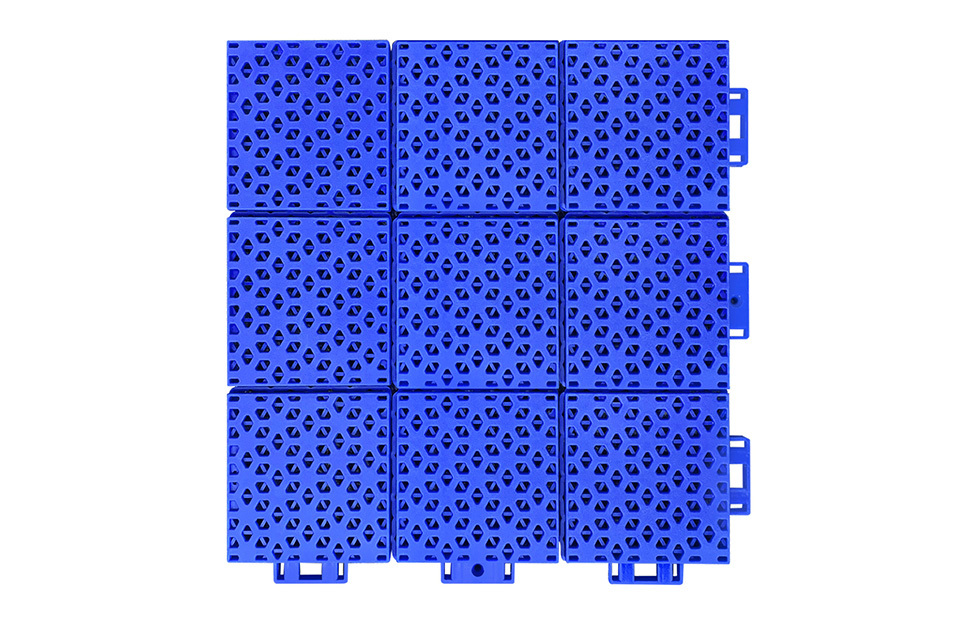 Top-down view of a 305×305×16mm double-layer hexagonal polypropylene interlocking playground tile showing the widened and thickened matte texture surface, designed for superior anti-slip performance on primary school, secondary school, and kindergarten outdoor playground surfaces.