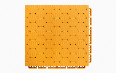 Close-up detail of the dense interlocking connection system between two adjacent thermoplastic rubber sports tiles, showing the perimeter locking geometry that secures panels in planar alignment without adhesive or mechanical fasteners.