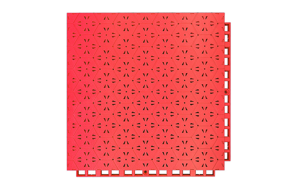 Underside and profile view of a 305×305×14mm TPR safety flooring tile showing the six-direction support foot geometry, which distributes fall impact loads radially across the substrate in six directions, and the drainage hole exits, for sports field and kindergarten outdoor safety surface installations.