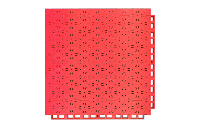 Underside and profile view of a 305×305×14mm TPR safety flooring tile showing the six-direction support foot geometry, which distributes fall impact loads radially across the substrate in six directions, and the drainage hole exits, for sports field and kindergarten outdoor safety surface installations.