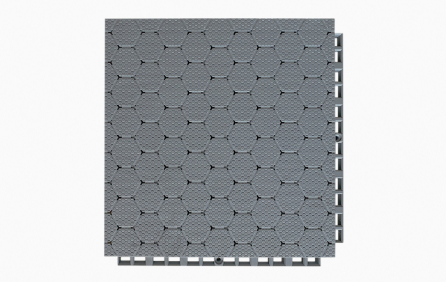 Top-down view of a 305×305×21mm TPV soft elastic sports flooring tile showing the thickened hexagonal dark pattern surface texture and the large flat soft material surface layer, designed for anti-slip grip and fall protection performance in professional school, college, and competition sports venue installations.
