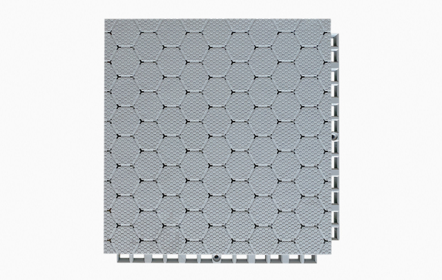 Angled profile and underside view of a 305×305×21mm TPV soft elastic sports flooring tile showing the octagonal ring-shaped base geometry and reinforced support corners of the dense interlocking connection system, illustrating the two-stage fall attenuation structure and inter-tile alignment mechanism for professional sports venue use.