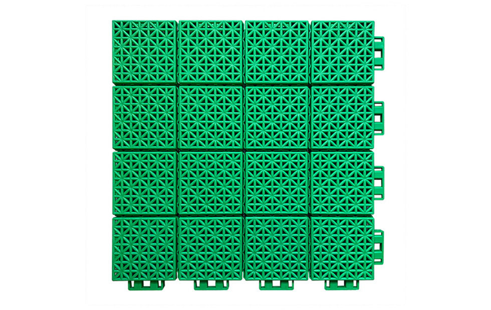 Top-down view of a 300×300×13mm soft connection polypropylene interlocking sports tile showing the combination of different-sized blocks surface pattern, designed for anti-slip performance and thermal expansion management across large-area basketball court, badminton court, and kindergarten activity area installations.