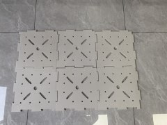 Installed 10mm LDPE shock pad rolled out as a continuous subsurface underlay beneath an artificial turf system on a sports field, showing the waterproof closed-cell LDPE material surface, subbase coverage, and the underlay's position in the synthetic turf system stack below the turf backing for football field, rugby field, or multi-sport synthetic turf installation.