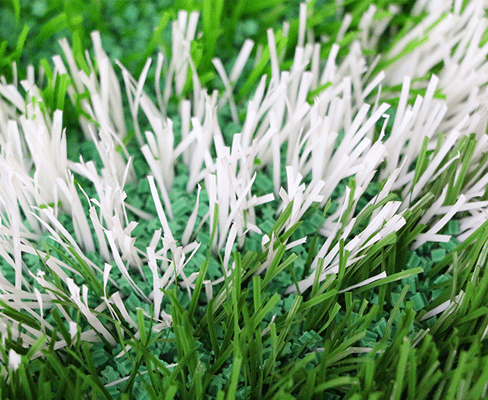 Close-up macro view of snowflake type TPE eco-friendly artificial grass infill granules showing the multi-point branched particle geometry, designed for open packing and drainage performance in synthetic turf systems for golf courses, football fields, and other sports venue applications.