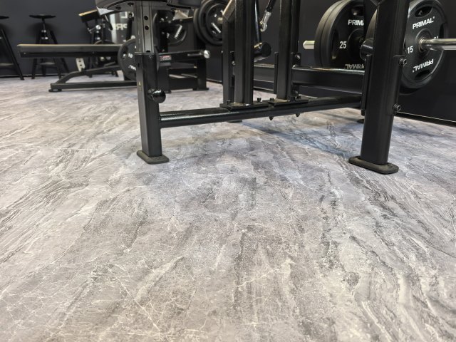 Copolymer surface rubber floor tile in commercial flooring project deployment showing installed tile array, compact surface appearance, customizable pattern design, and integration with commercial facility floor area
