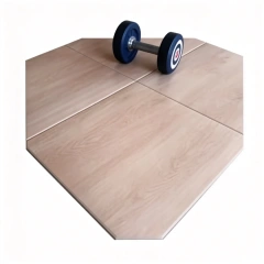 High-magnification surface detail of wood-grain rubber floor tile showing the high-definition printed pattern design and protective wear-resistant surface layer construction, illustrating scratch resistance and surface texture integrity under commercial foot traffic conditions.