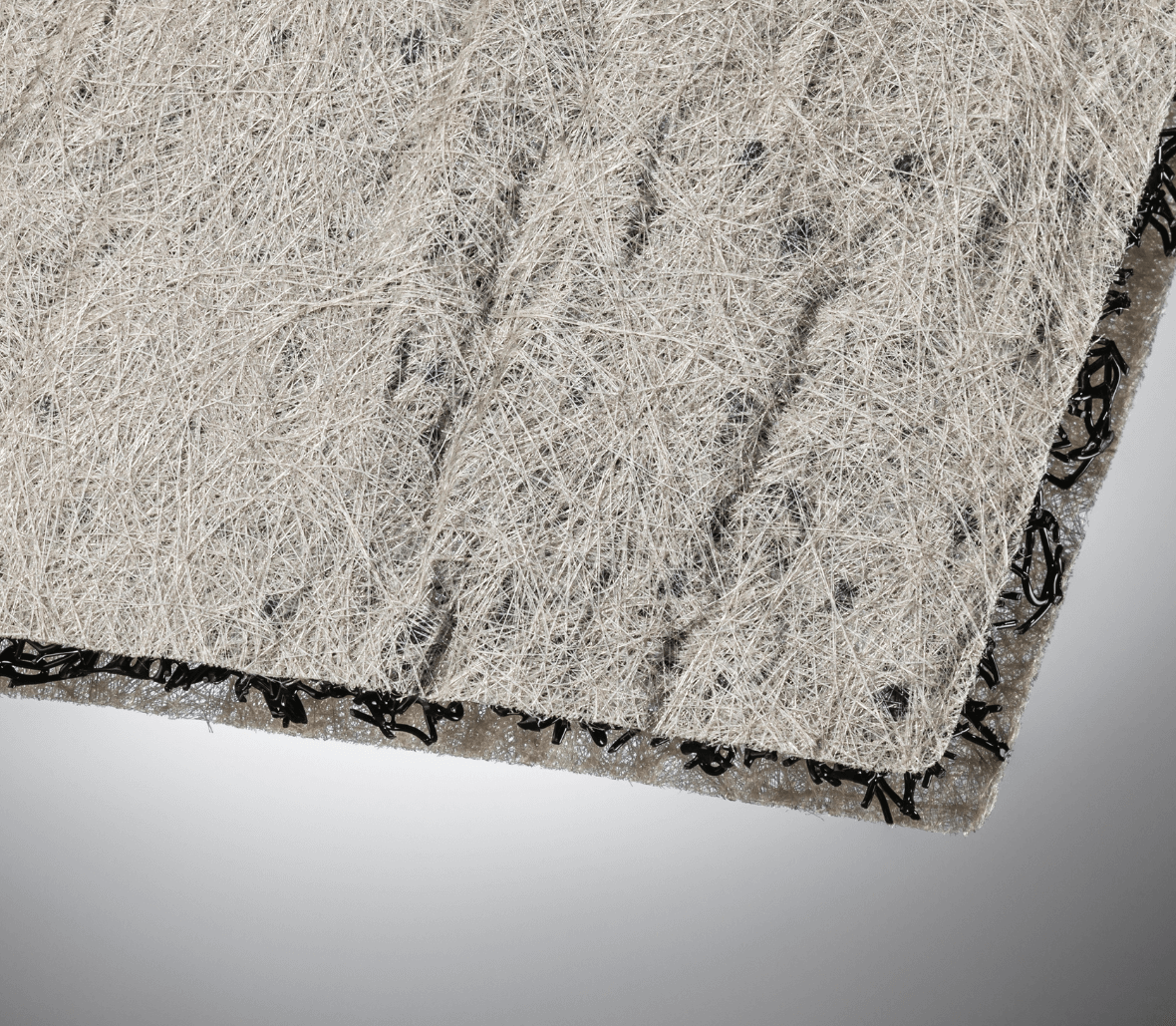 Cross-section view of composite drainage geomat core and geotextile layers