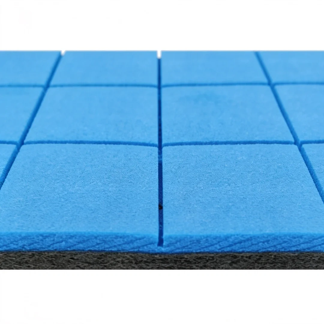 Blue-black composite shock pad installed beneath artificial turf system