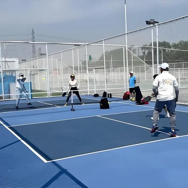 Outdoor pickleball court using acrylic PVC flooring mat system