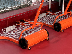Close-up technical engineering view showing the rolling mechanical wire pickup drum and the adjustable handle attachment mechanism.