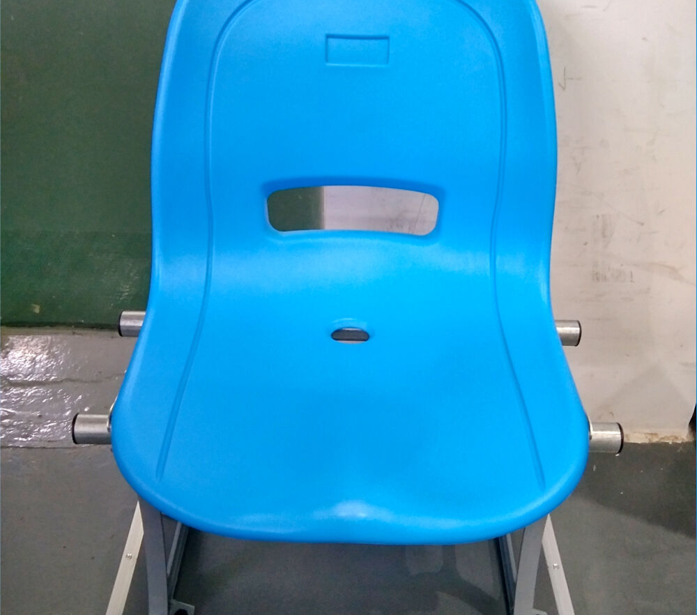Eco-H HDPE blow molded stadium seats in flat installation configuration on a metal structure bleacher deck, showing full-backrest seat profile, seat-to-frame bracket geometry, and row alignment