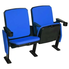 Arena upholstered seat fully deployed in multi-row stadium configuration — premium fabric upholstery, one-piece molded bent wood board lining, Z-shape powder-coated steel legs, floor-mounted base plates, recessive auto-rebound tip-up in open position