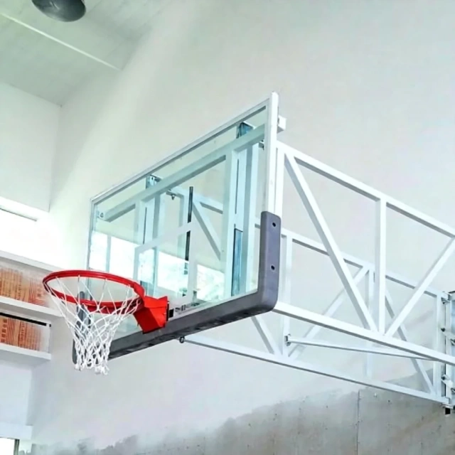 Close-up of FIBA wall mounted basketball stand fold diagonal brace locking device and threaded locking pin mechanical assembly showing dual-lock engagement geometry, steel tube frame connection at fold joint, and locking hardware detail for side-fold backstop secured-play position confirmation