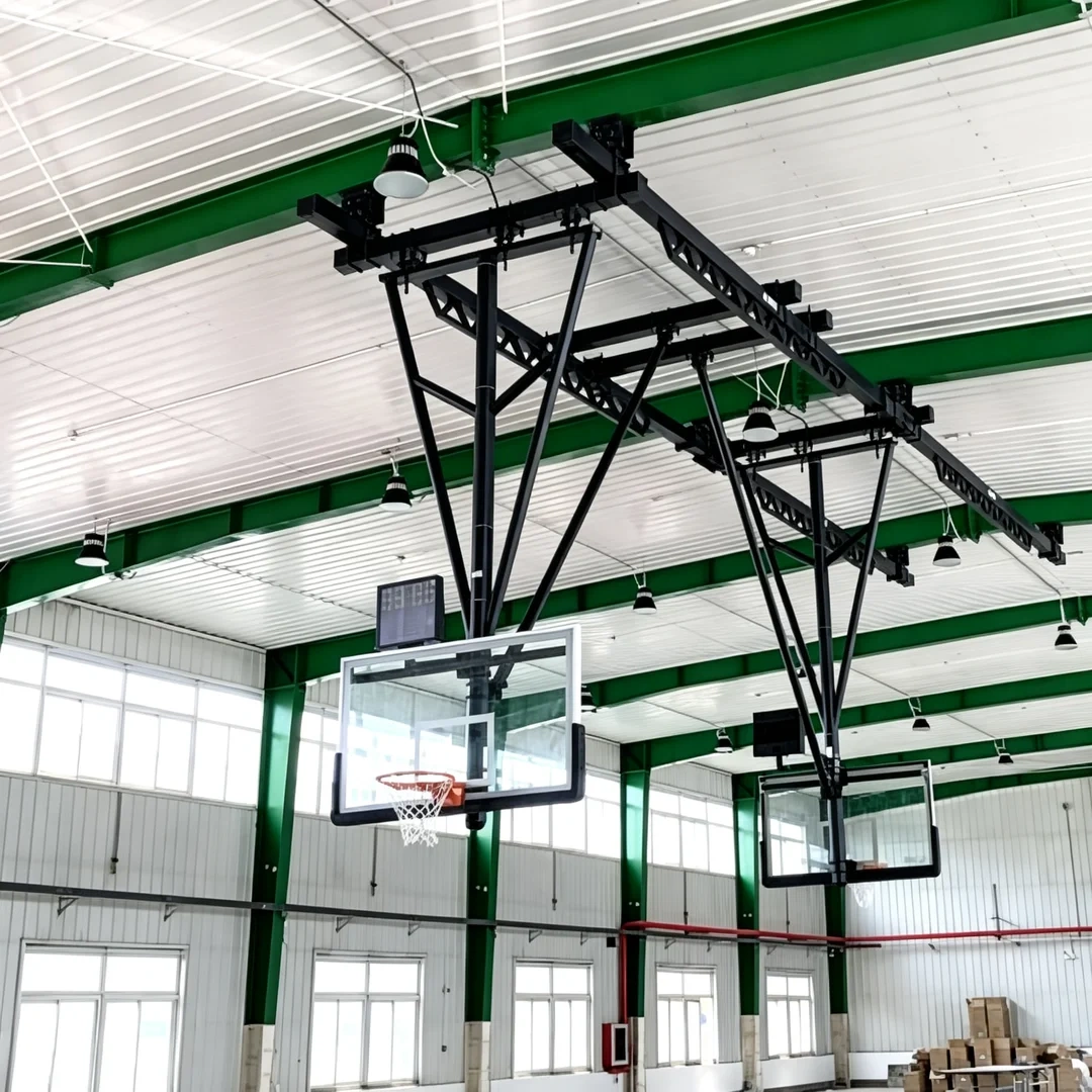 Suspension basketball rack 72" × 42" × ½" glass backboard with protective edge pad showing backboard glass thickness, FIBA-compliant backboard dimension profile, edge pad perimeter coverage, and backboard-to-frame attachment interface at competition basketball arena or school gymnasium