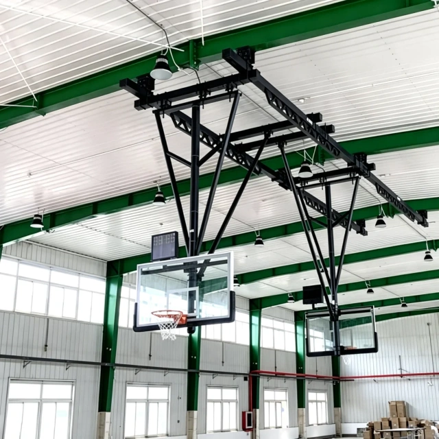 Suspension basketball rack 72" × 42" × ½" glass backboard with protective edge pad showing backboard glass thickness, FIBA-compliant backboard dimension profile, edge pad perimeter coverage, and backboard-to-frame attachment interface at competition basketball arena or school gymnasium