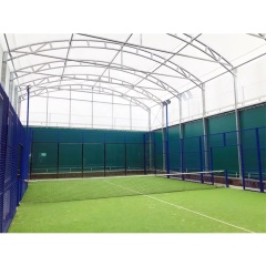 Padel court H007R simple roof steel structure assembly showing hot dip galvanized roof rafter and purlin framing, roof-to-court perimeter frame integration at foundation anchor points, and structural steel canopy geometry above 20×10m court footprint during installation phase