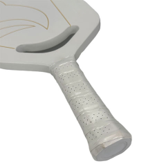 Close-up detail view showing the flush water label application along the molded Edgeless guard edge of the Edgeless Pickleball Paddle frame perimeter.